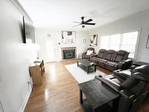 Spacious living room with leather recliners at West Georgia Wellness Center, a detox center in Atlanta.