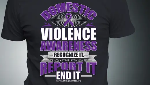 Purple awareness shirt promoting domestic violence awareness at Defying the Odds Inc, a detox center in Atlanta.