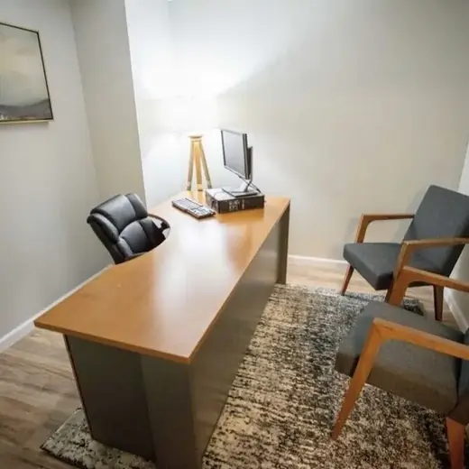 Bright office space with desk and chairs at Good Landing Recovery detox center in Atlanta.
