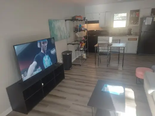 Bright living area with a TV at Acworth Outpatient Detox, a detox center in Atlanta.