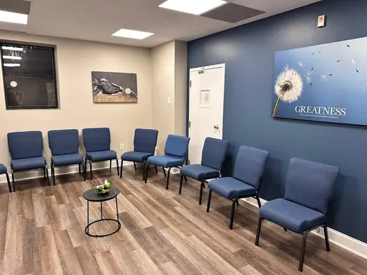 Comfortable waiting area with blue chairs at Summit Wellness Group Mental Health Treatment Center, partial hospitalization program in Atlanta.